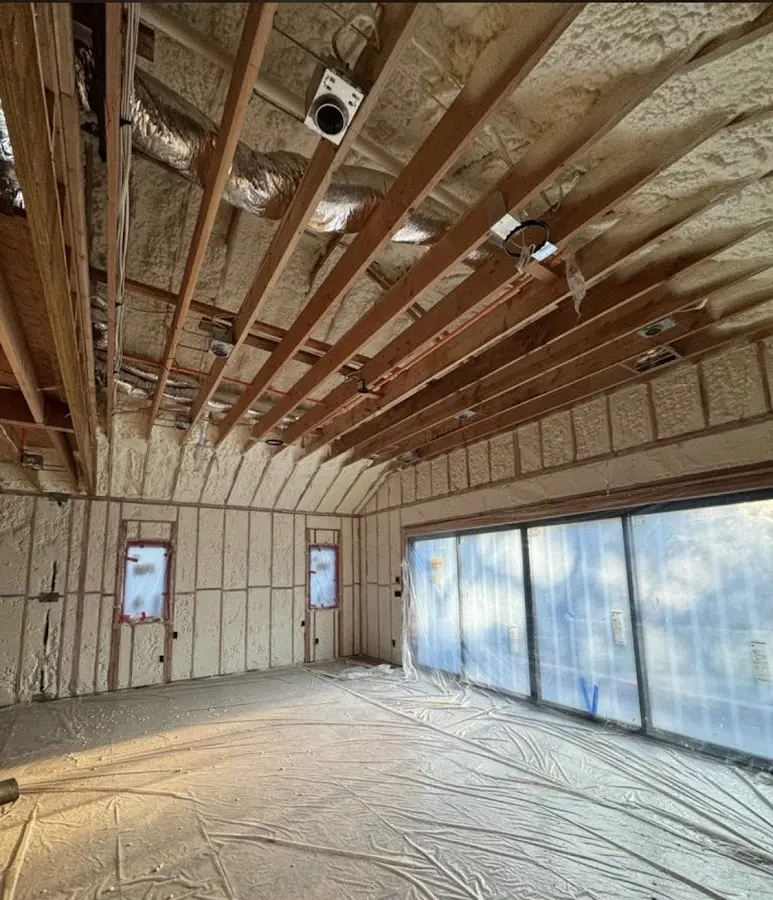 Interior walls and ceiling insulated with spray foam during new construction in Plumas Lake